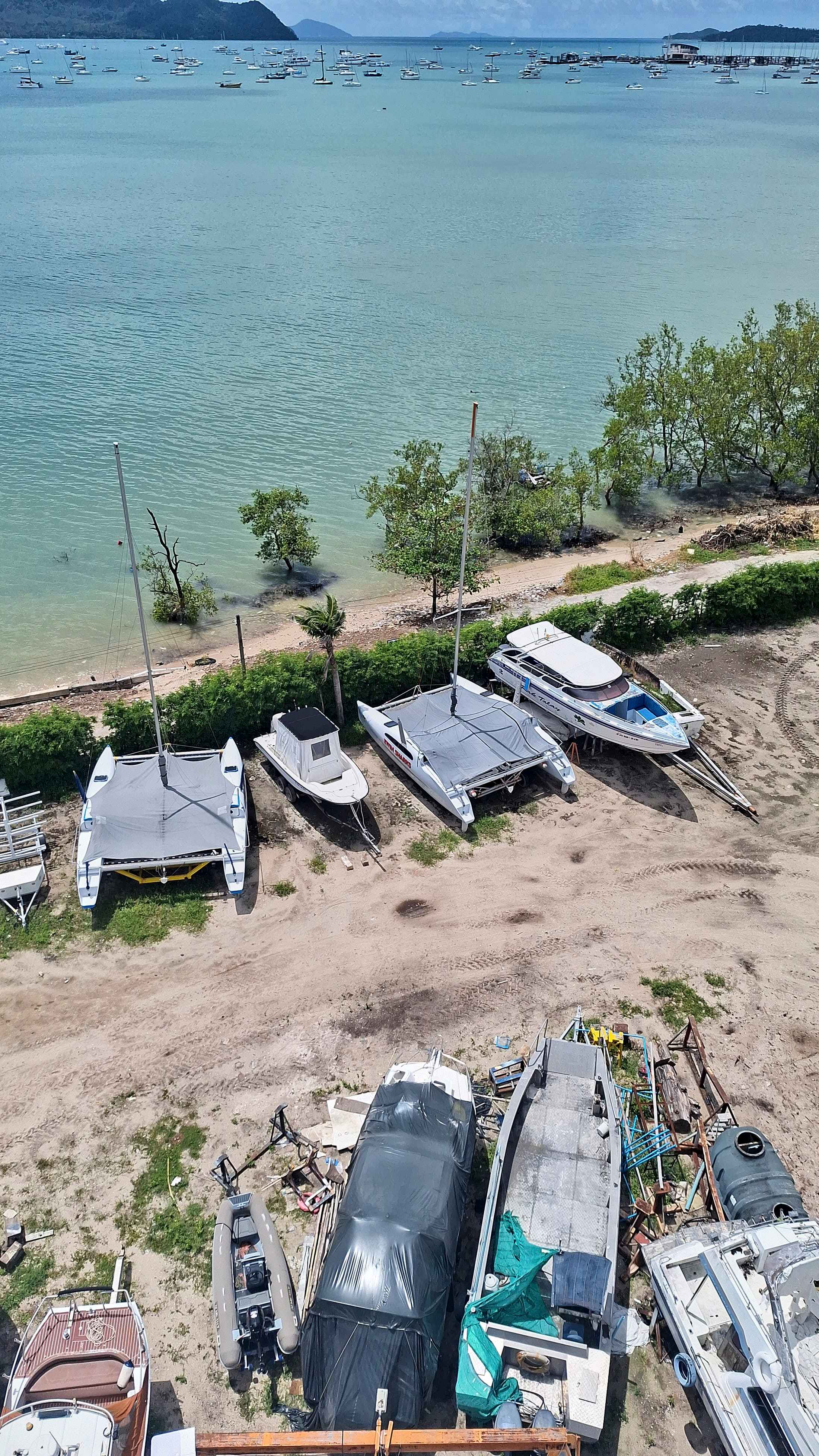 A young Asian couple enjoying a drink on a charter boat